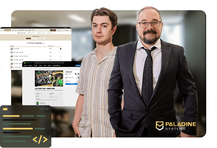 Two members of the Paladine Systems team standing in the Click Click Media office with screenshots of a custom clinic booking system and an event registration platform, with code editor icons and the Paladine Systems logo.