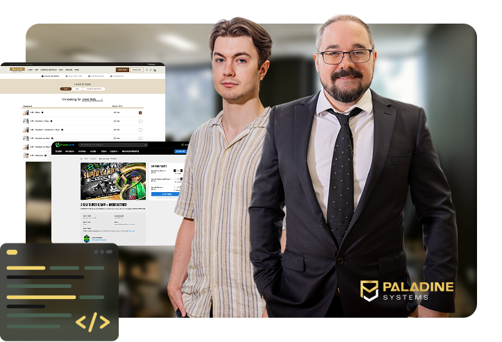 Two members of the Paladine Systems team standing in the Click Click Media office with screenshots of a custom clinic booking system and an event registration platform, with code editor icons and the Paladine Systems logo.