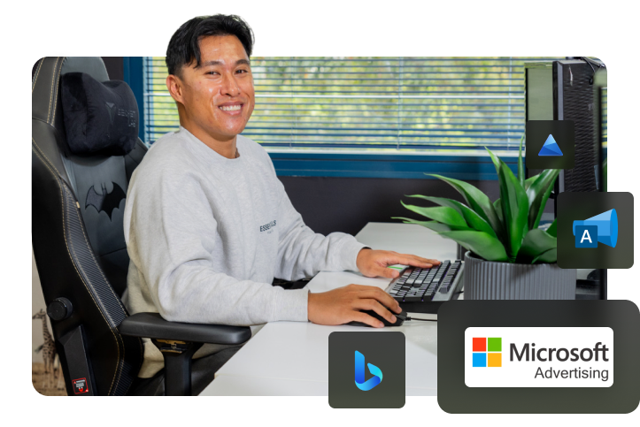 Click Click Media team standing in the Norwest office, with Microsoft Advertising and Bing badges overlaid