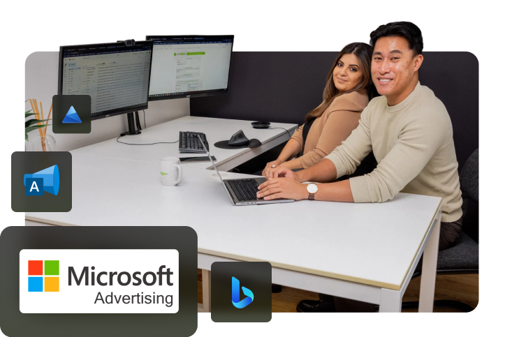 Bing advertising office photoshoot including Amanda and Adriel. Two Bing ads certified professionals sharing a desk for a photoshoot.
