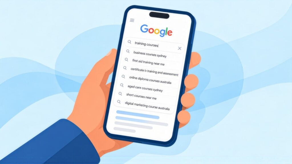 Hand holding a phone with Google suggestions for training courses, including first aid training near me and certificate iv training and assessment